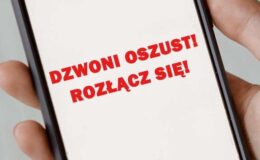 napis na wyświetlaczu telefonu "Dzwoni oszust! Rozłącz się!"